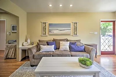 a living room with a couch and a table at Oceanside Home with Yard - Walk to Beach and Pier in Oceanside