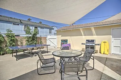 a patio with a table and chairs and a grill at Oceanside Home with Yard - Walk to Beach and Pier in Oceanside