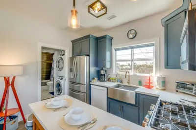 a kitchen with blue cabinets and a sink at San Diego Guest House Apartment with Patio and Hot Tub in San Diego