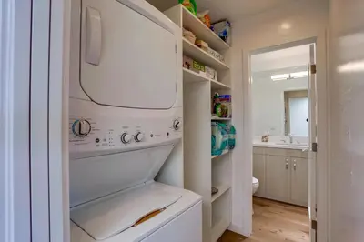 a white washer and dryer in a bathroom at Beach Access Oceanview SBTC331 Condo in Solana Beach
