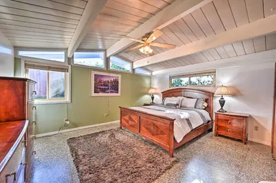 a bedroom with a bed and a ceiling fan at La Jolla Home and Detached Suite Hot Tub and Backyard in San Diego