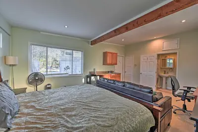 a bedroom with a large bed and a couch at La Jolla Home and Detached Suite Hot Tub and Backyard in San Diego