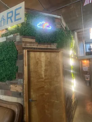 a door to a store with a sign on the wall at PodShare San Diego in San Diego