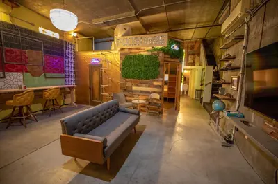 a living room with a couch and a table at PodShare San Diego in San Diego
