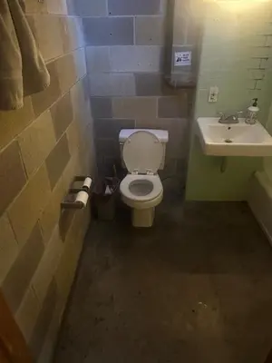 a bathroom with a toilet and a sink at PodShare San Diego in San Diego