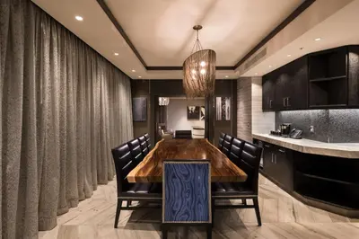 a dining room with a wooden table and chairs at Viejas Casino & Willows Hotel in Alpine
