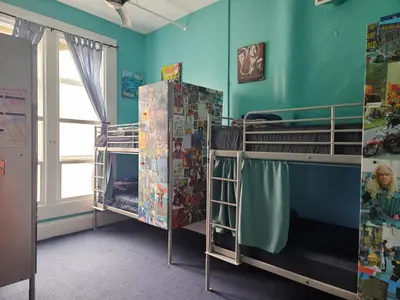 a room with two bunk beds and a window at Gaslamp Hostel in San Diego