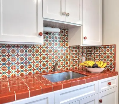 a kitchen counter with a sink and a bowl of fruit at Beachcomber Inn in San Clemente