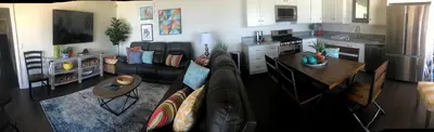 a living room with a couch and a table at Beachcomber Inn in San Clemente