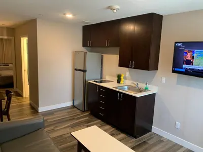 a kitchen with a sink and a refrigerator at Solis Place in Old Town in San Diego