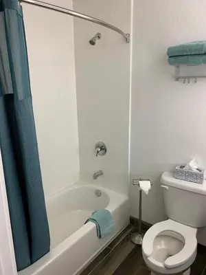 a bathroom with a tub and a toilet and a shower at Solis Place in Old Town in San Diego