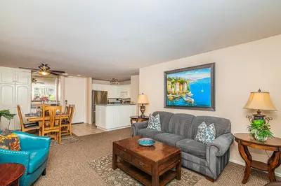 a living room with a couch and a table at G218 - Palms Away in Oceanside