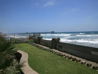 a walkway next to the beach with the ocean at D17 - Beach Retreat in Oceanside
