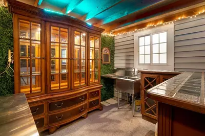 a kitchen with wooden cabinets and a sink at The Heart of Julian in Julian