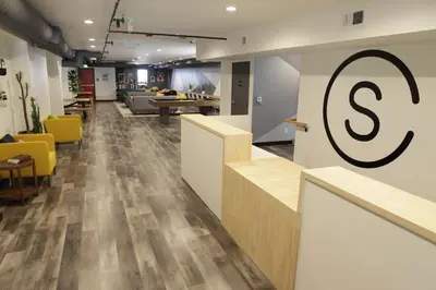 an office with a large s sign on the wall at Stay Classy in San Diego