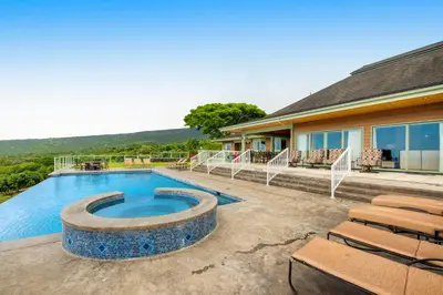 a house with a swimming pool and a patio at ENC-183 - SeaBluffe Escape in Encinitas