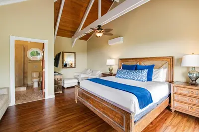 a bedroom with a bed and a ceiling fan at ENC-183 - SeaBluffe Escape in Encinitas