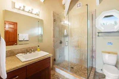 a bathroom with a shower and a sink and a toilet at ENC-183 - SeaBluffe Escape in Encinitas