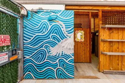 a door with a painting of a swan on it at Samesun Ocean Beach Hotel & Hostel in San Diego