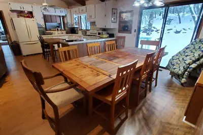a wooden dining table and chairs in a kitchen at Pine Hills Cabin in Julian in Julian