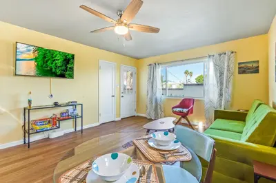 a living room with a couch and a table at Pacific Sunrise in San Diego