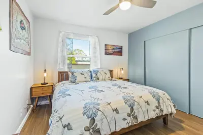 a bedroom with a bed and a window at Pacific Sunrise in San Diego