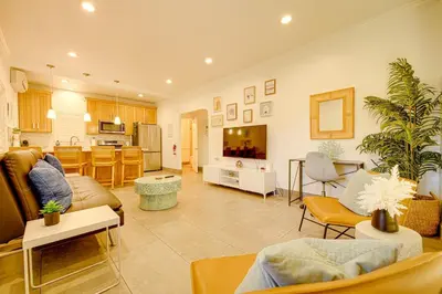 a large living room with a couch and a kitchen at 1000#1 Contemporary Home w/ Parking, Grill, & AC! in Newport Beach