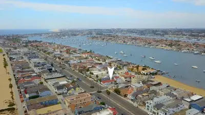 an aerial view of a city with boats in the water at 1000#1 Contemporary Home w/ Parking, Grill, & AC! in Newport Beach