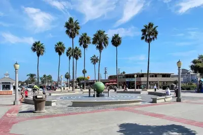 a plaza with palm trees and a fountain with a ball at 1000#5 Premier Modern Home w View, Parking, and AC in Newport Beach