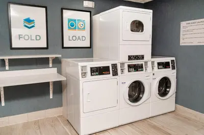 a laundry room with two washer and dryer at Staybridge Suites - Temecula - Wine Country by IHG in Temecula