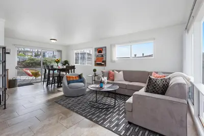 a living room with a couch and a table at Victoria #5 in San Clemente