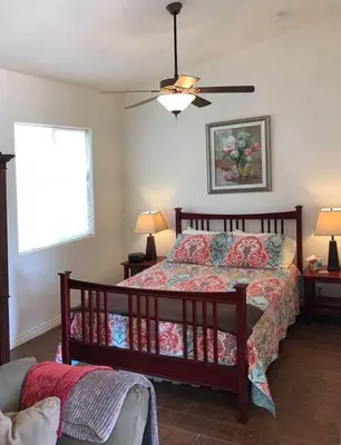 a bedroom with a bed and a ceiling fan at Beautiful new detached casita nestled in scenic southern CA foothills! in Fallbrook