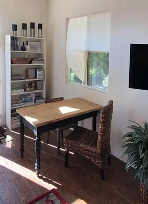 a dining room table and a chair in a room at Beautiful new detached casita nestled in scenic southern CA foothills! in Fallbrook