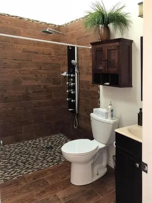a bathroom with a toilet and a shower and a sink at Beautiful new detached casita nestled in scenic southern CA foothills! in Fallbrook