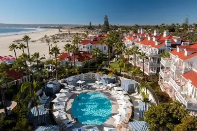 an aerial view of a resort with a swimming pool and a beach at Beach Village at The Del, LXR Hotels & Resorts in San Diego