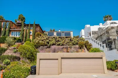 a garage door in front of a house at 26' SUNDECK OCEAN Panoramic VIEWS with AC Fast WiFi -902Mbps in San Diego
