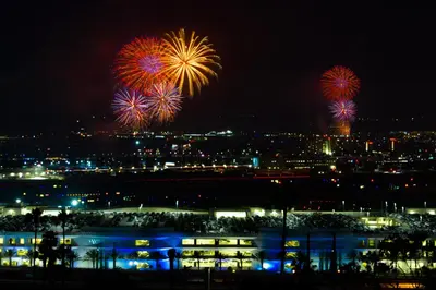 a fireworks display over a city at night at 26' SUNDECK OCEAN Panoramic VIEWS with AC Fast WiFi -902Mbps in San Diego