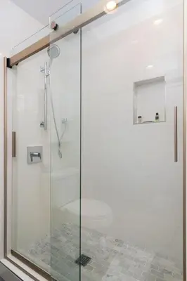 a shower with a glass door in a bathroom at Sands Of La Jolla in San Diego