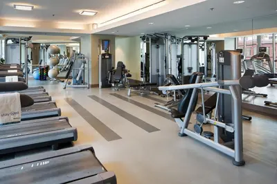 a gym with treadmills and cardio machines at Omni San Diego Hotel at the Ballpark in San Diego