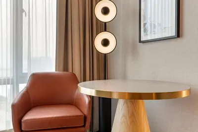 a chair and a table in a room at Omni San Diego Hotel at the Ballpark in San Diego