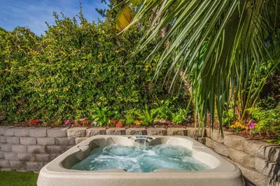 a bath tub with a fountain in a garden at Beach Resort Home with Ocean Views Jacuzzi & Sauna! in San Diego