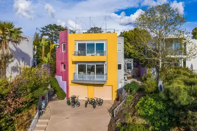 a house with bikes parked in front of it at Beach Resort Home with Ocean Views Jacuzzi & Sauna! in San Diego