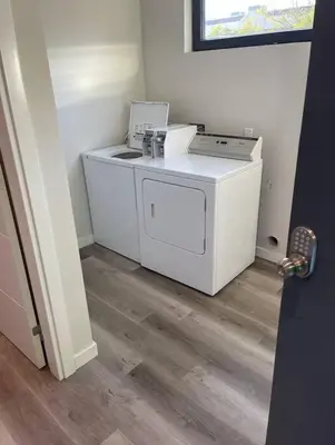 a kitchen with a washer and dryer in a room at Centrally Located Cozy Studio Apartment in SD in San Diego