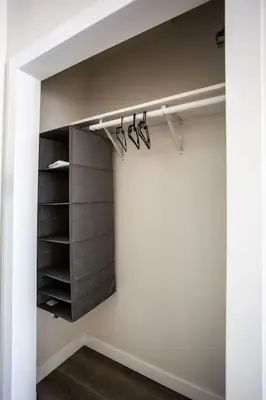 a room with a closet with black shelves at Lovely Studio w Full Kitchen in Heart of San Diego in San Diego
