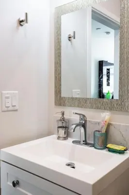 a white bathroom with a sink and a mirror at Lovely Studio w Full Kitchen in Heart of San Diego in San Diego