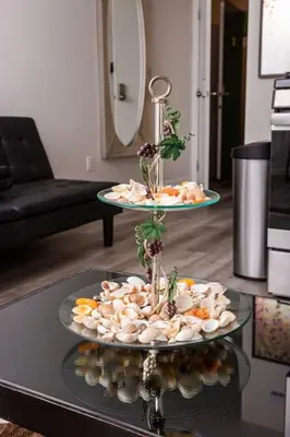two plates of food on a table in a living room at Lovely Studio w Full Kitchen in Heart of San Diego in San Diego