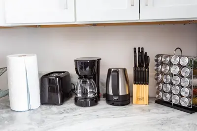 a kitchen counter with a blender and paper towels at Luxurious Furnished Studio w Full Kitchen in SD in San Diego