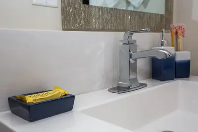 a sink with a faucet and a box on it at 2 Bedroom, 2 Bathroom Detached Apt Max 7 Sleepers in San Diego