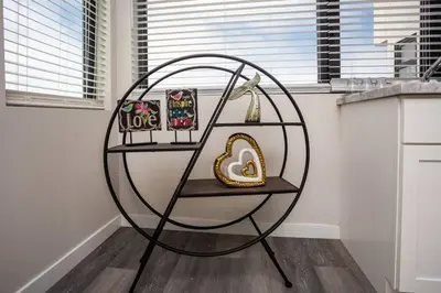 a round shelf in a kitchen with a round table at 2 Bedroom, 2 Bathroom Detached Apt Max 7 Sleepers in San Diego