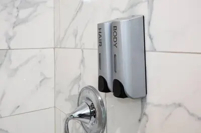 a close up of a shower handle in a bathroom at One Bedroom Apartment with SD Downtown View in San Diego